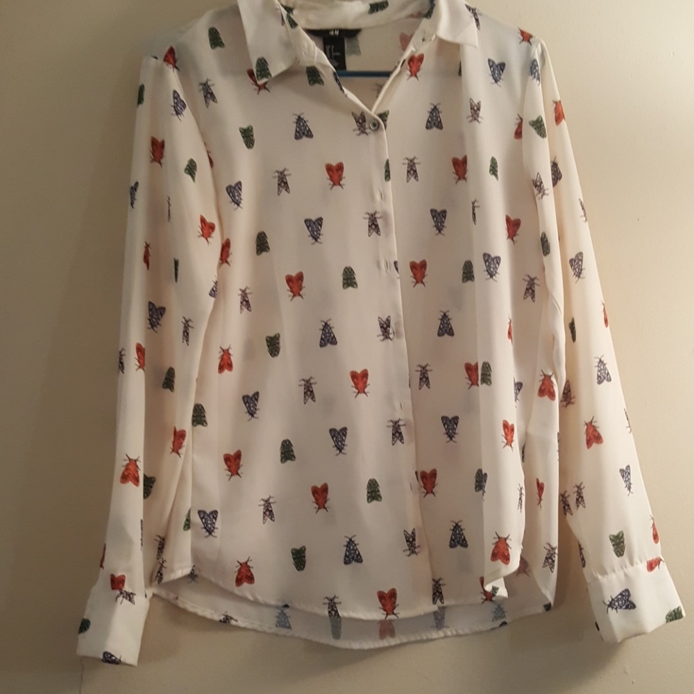 Long sleeved sheer white and bug shirt